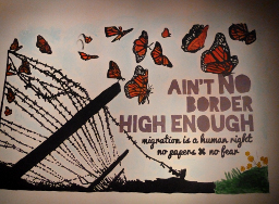[Ain't no border high enough – mogration is a human right – no gagers – no fear]